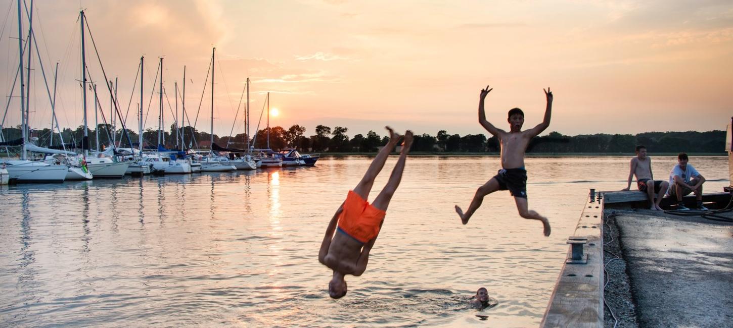 Children jumping in Water at Præstø Havn, Zealand