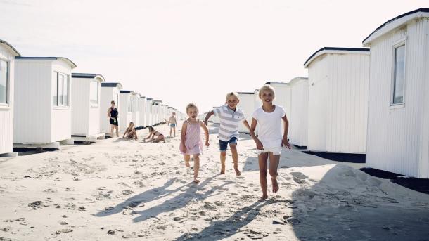 Children running on Løkken Beach, North Jutland