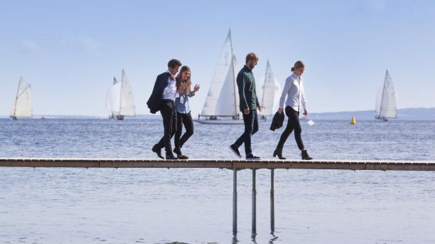 Business people walking on Aarhus infinite bridge