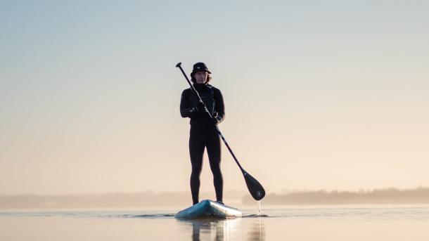 Man stand up paddling at Lynæs in North Zealand