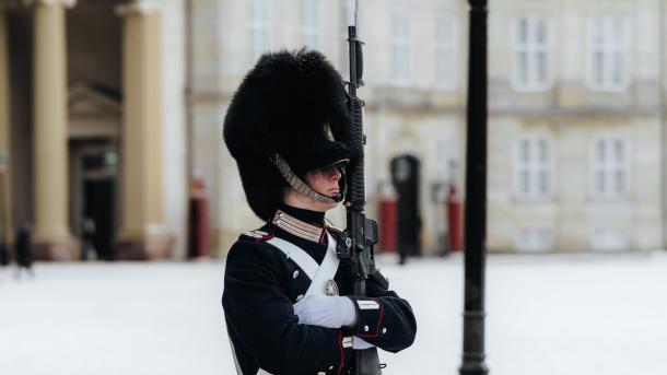 A castle guard in uniform outside Amalienborg