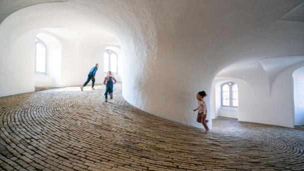 Kids running inside Rundetaarn in Copenhagen