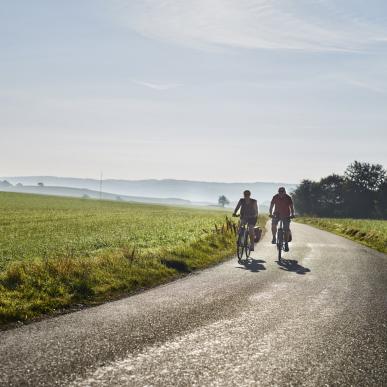 Couple biking in Djursland